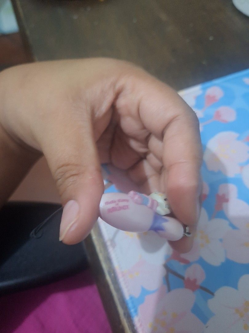 Hello Kitty Bowling Pin Keychain (Category: Character Goods) located in Calatagan. Submitted by zigi_finds (Listing ID 1424096123, Image 2). Description: - Adorable Kitty keychain. - Features Kitty on a pink bowling pin. - Includes a silver-colored chain. - Easy to attach to bags or keys. - Cute accessory for any Kitty fan..