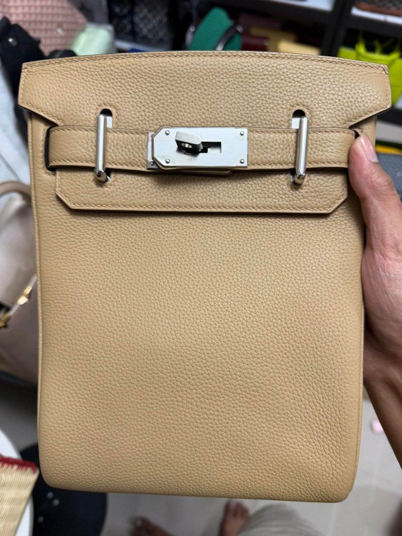 Hermes Kelly Messenger Bag (Category: Luxury Bags & Wallets) located in Manila. Submitted by rosmiemuno16247 (Listing ID 1424060727, Image 3). Description: - Hermes Body Messenger Bag - Color: Tan - Silver-tone hardware - Detachable shoulder strap - Includes lock and keys - Textured leather exterior - Leather clochette - Lined interior.