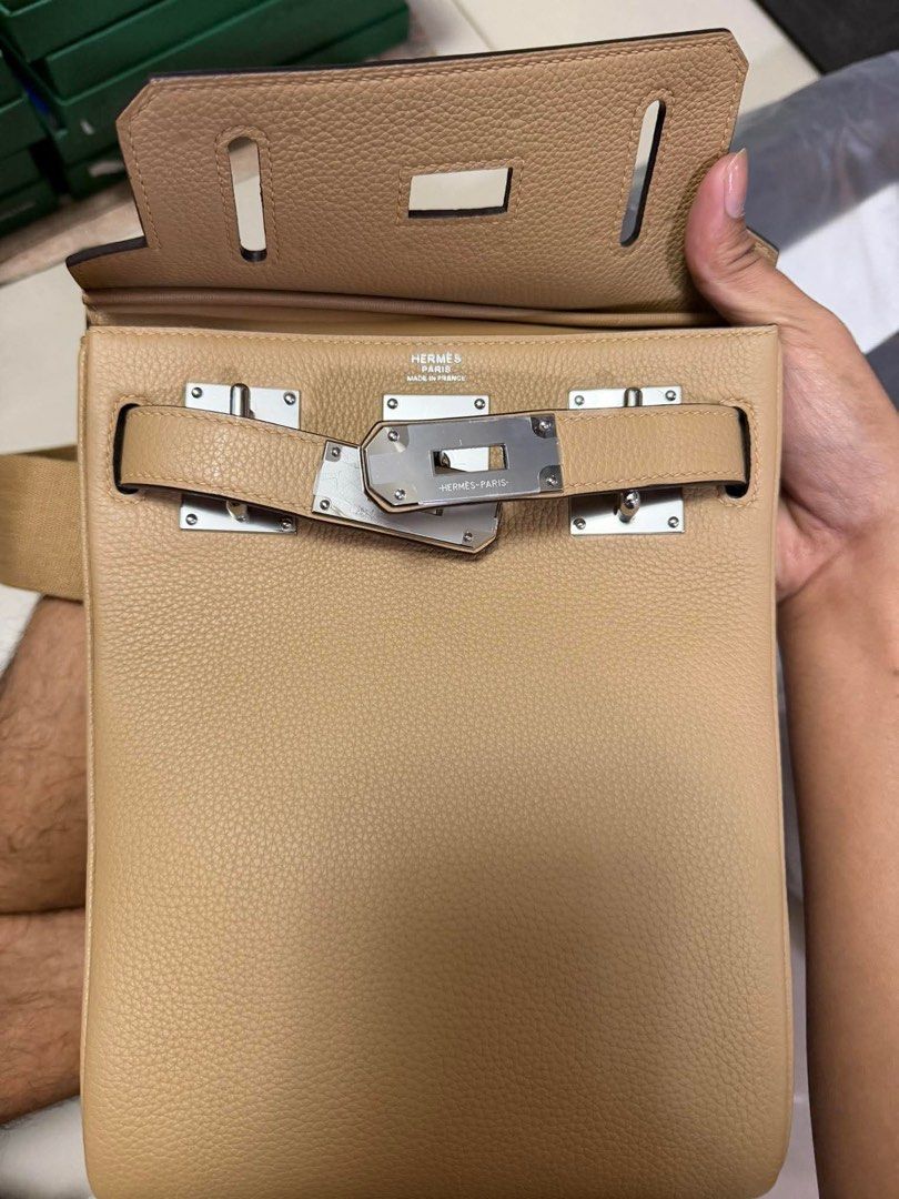 Hermes Kelly Messenger Bag (Category: Luxury Bags & Wallets) located in Manila. Submitted by rosmiemuno16247 (Listing ID 1424060727, Image 2). Description: - Hermes Body Messenger Bag - Color: Tan - Silver-tone hardware - Detachable shoulder strap - Includes lock and keys - Textured leather exterior - Leather clochette - Lined interior.