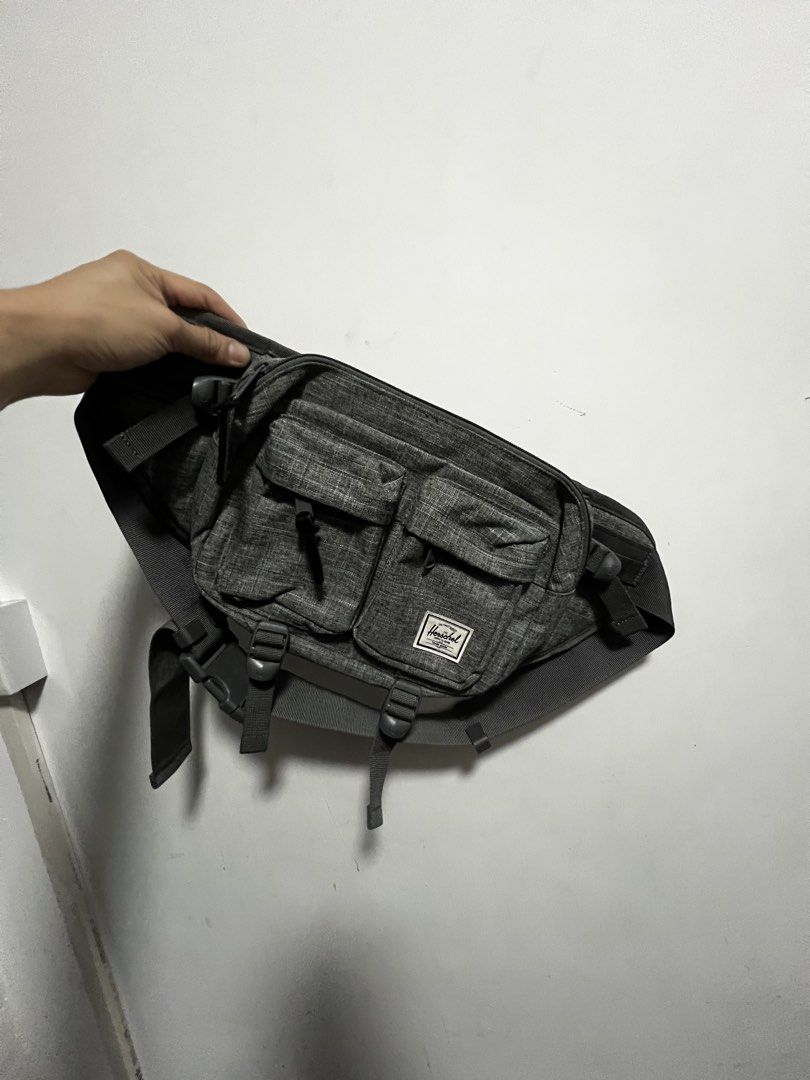 Herschel Supply Co. Fanny Pack (Category: Belt bags, Clutches and Pouches) located in Dasmarinas. Submitted by corruptdot (Listing ID 1424013344, Image 2). Description: - Herschel Supply Co. fanny pack - Color: Gray - Multiple front pockets - Adjustable strap - Red and white striped interior lining - Padded mesh back panel for comfort - Herschel logo patch and zipper pull.