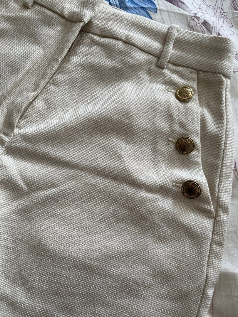H&M Cream Shorts with Gold Buttons (Category: Shorts) located in Taguig. Submitted by luxe_rewind (Listing ID 1424043531, Image 3). Description: - H&M cream-colored shorts - Features gold buttons - Size: EUR 36 - Textured fabric - Tailored fit - Zipper and button closure.