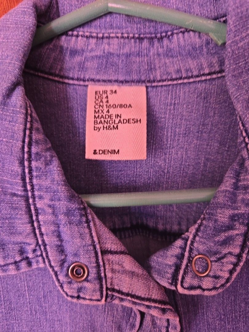 H&M Denim Shirt - Size 34 (Category: Shirts) located in Munoz. Submitted by prelvdbycns (Listing ID 1424024053, Image 2). Description: - H&M blue denim shirt - Size 34 - Two chest pockets - Button closures - Long sleeves - Classic collar - Made in Bangladesh.