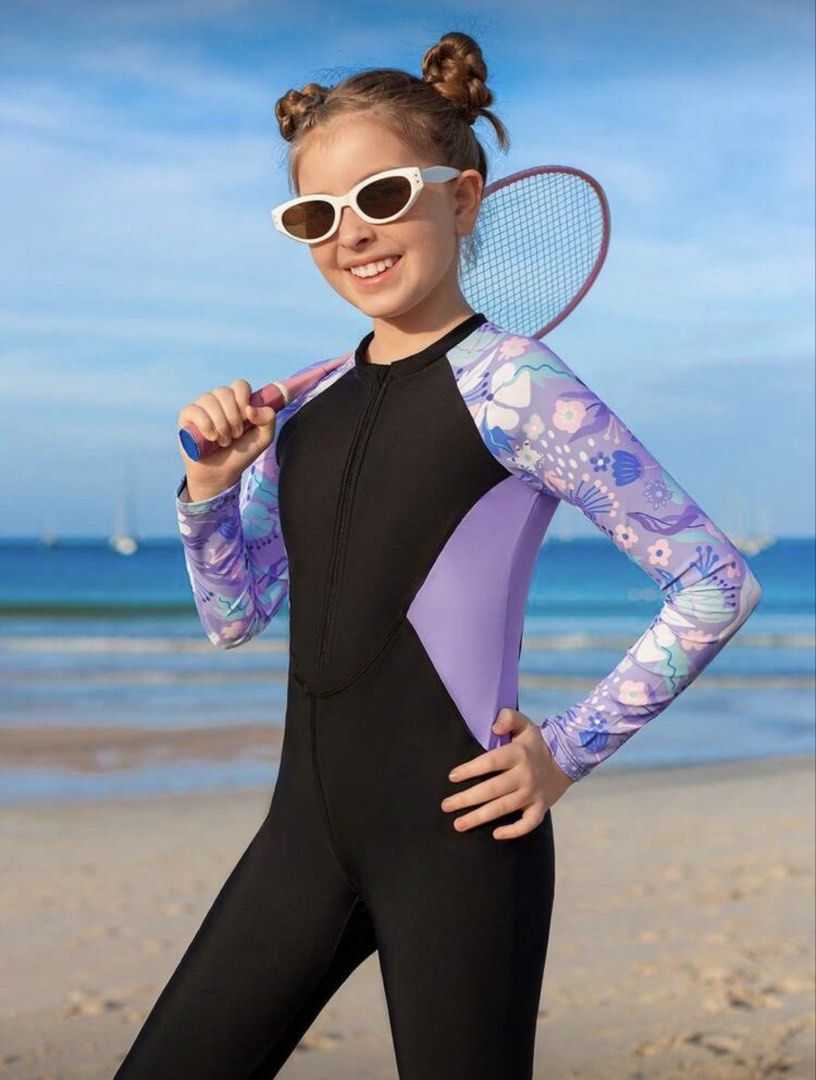 Kids' Long Sleeve Swimsuit (Category: Babies & Kids Fashion) located in Paranaque City. Submitted by belle_cloud (Listing ID 1423999024, Image 2). Description: Brand new Kids swimwear | For 8-10yold (runsbig) fitted with pads. - Long-sleeved swimsuit for kids - Features a black body - Purple and floral patterned sleeves and side panels - Front zipper for easy wear - Comfortable fit - Ideal for swimming and beach activities - Provides sun protecti