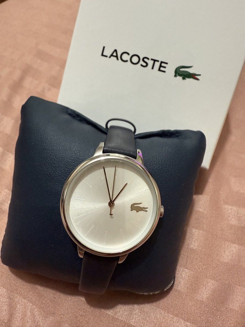 Lacoste Women's Watch (Category: Women's Watches) located in Pasig City. Submitted by kldy_closet_03 (Listing ID 1424143085, Image 1). Description: - Lacoste women's watch - Silver dial - Dark blue leather strap - Features the Lacoste logo - Comes with original box - Perfect for everyday wear *For battery replacement *.