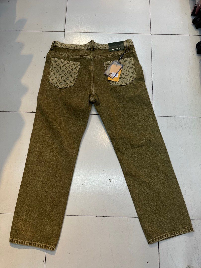 Louis Vuitton Monogram Jeans L676# Size 36 (Category: Jeans) located in Antipolo. Submitted by _lprpnzz (Listing ID 1424055814, Image 2). Description: Authentic Louis Vuitton jeans featuring the iconic monogram pattern on the back pockets and waistband. The jeans have a straight leg cut and a button closure with the Louis Vuitton logo. The size is 36. The jeans have a unique olive green color..