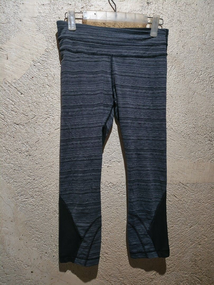Lululemon Cropped Leggings Size 6 (Category: Activewear) located in San Pedro. Submitted by dacianizer (Listing ID 1424089173, Image 2). Description: - Lululemon cropped leggings - Size: 6 - Color: Gray and black pattern - Features a small back zipper pocket - Mesh detailing on lower legs - Lululemon logo visible - Designed for athletic activities.