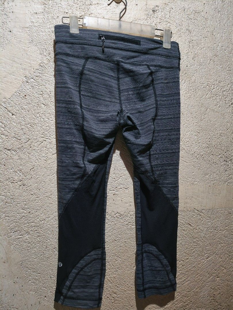 Lululemon Cropped Leggings Size 6 (Category: Activewear) located in San Pedro. Submitted by dacianizer (Listing ID 1424089173, Image 3). Description: - Lululemon cropped leggings - Size: 6 - Color: Gray and black pattern - Features a small back zipper pocket - Mesh detailing on lower legs - Lululemon logo visible - Designed for athletic activities.