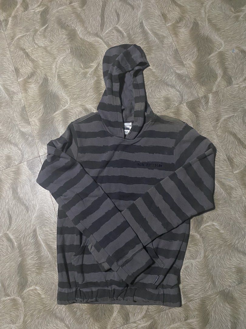 Macbeth Striped Hoodie - XS (Category: Hoodies) located in Caloocan City. Submitted by senglavs (Listing ID 1424060172, Image 1). Description: Macbeth hoodie in gray and black stripes. Features a hood and a front pocket. The size is XS. The hoodie has the Macbeth logo on the chest. Measurements are approximately 23 inches in length and 17.5inches across the chest. The sleeve length is about 7inches Issue: may kupas sa bandang shoulder Loc. North 