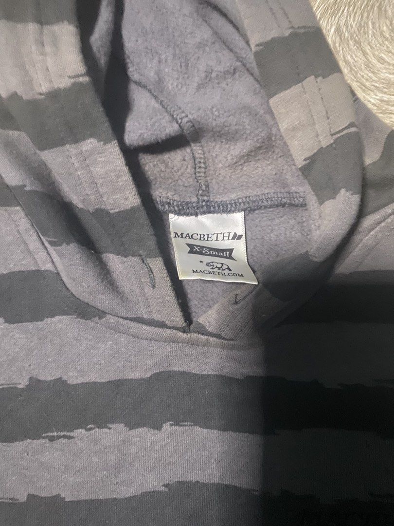 Macbeth Striped Hoodie - XS (Category: Hoodies) located in Caloocan City. Submitted by senglavs (Listing ID 1424060172, Image 2). Description: Macbeth hoodie in gray and black stripes. Features a hood and a front pocket. The size is XS. The hoodie has the Macbeth logo on the chest. Measurements are approximately 23 inches in length and 17.5inches across the chest. The sleeve length is about 7inches Issue: may kupas sa bandang shoulder Loc. North 