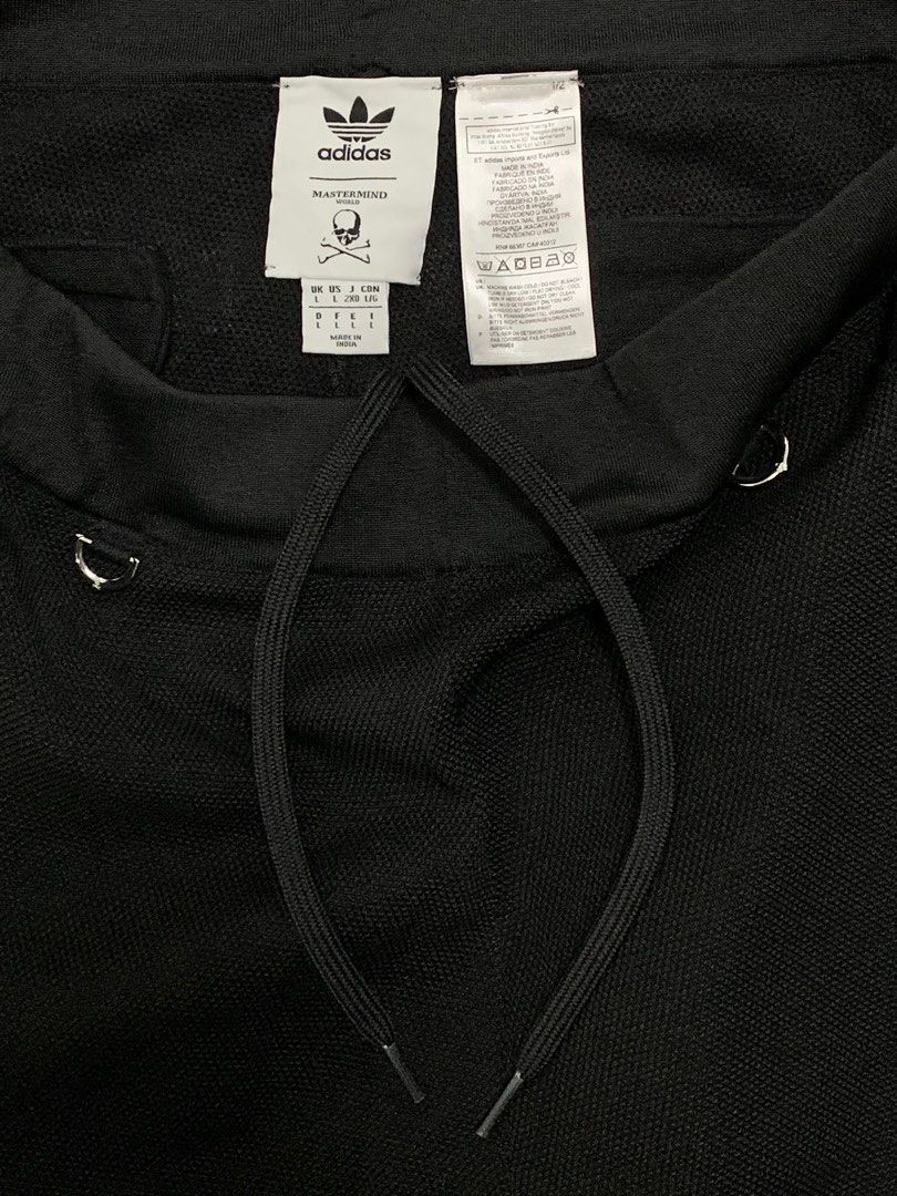 MASTERMIND JAPAN x ADIDAS CONSORTIUM TRACK PANTS (Category: Activewear) located in Cavite. Submitted by ___layern0ne (Listing ID 1424092902, Image 3). Description: Tagged Size: L (US|UK) Waistline: 33-37 (stretchable | can still be tightened) Front Rise: 14 inches Leg Opening: 6.2 inches Length: 41 inches Measured laid flat and at its longest point | Stretchable material Slightly wrinkled due to storage Worn few times | In great condition | No ma