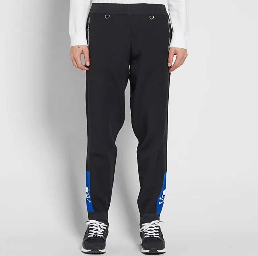 MASTERMIND JAPAN x ADIDAS CONSORTIUM TRACK PANTS (Category: Activewear) located in Cavite. Submitted by ___layern0ne (Listing ID 1424092902, Image 1). Description: Tagged Size: L (US|UK) Waistline: 33-37 (stretchable | can still be tightened) Front Rise: 14 inches Leg Opening: 6.2 inches Length: 41 inches Measured laid flat and at its longest point | Stretchable material Slightly wrinkled due to storage Worn few times | In great condition | No ma