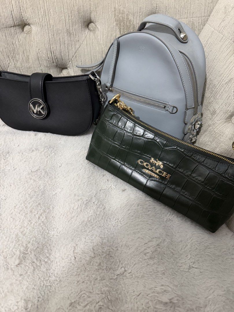 Michael Kors Black Handbag (Category: Luxury Bags & Wallets) located in Manila. Submitted by nini_archives (Listing ID 1424000225, Image 1). Description: Fendi backpack - 35k Coach - 25k Micheal Kors - 10k.