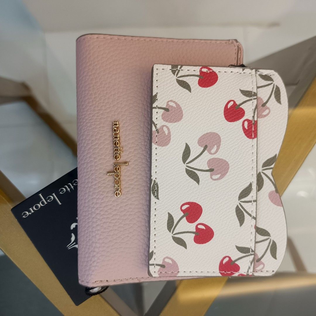 Nanette Lepore Cherry Hearts Wallet (Category: Wallets & Card holders) located in Dagupan City. Submitted by nmcmp4 (Listing ID 1424055119, Image 2). Description: - Nanette Lepore wallet - Pink exterior - Cherry print interior - Multiple card slots - Zippered compartment - Snap closure - Gold-tone logo - Style: "Ballet & Pink Cherry Hearts" - no box.