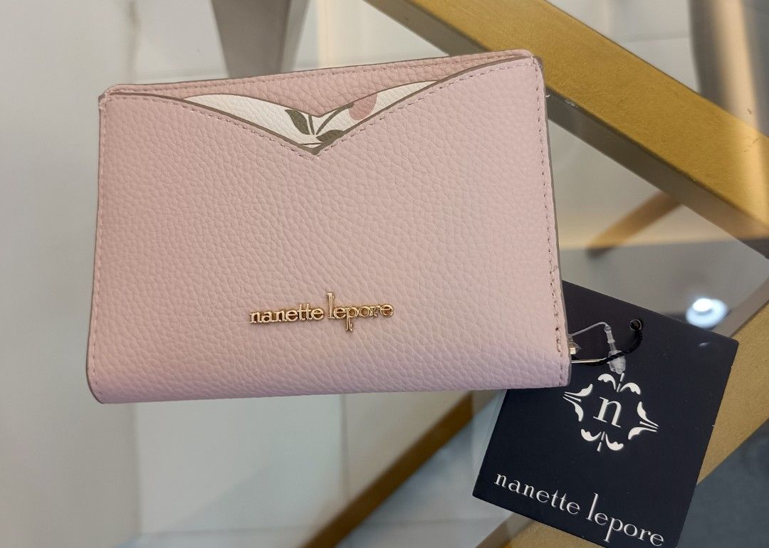 Nanette Lepore Cherry Hearts Wallet (Category: Wallets & Card holders) located in Dagupan City. Submitted by nmcmp4 (Listing ID 1424055119, Image 1). Description: - Nanette Lepore wallet - Pink exterior - Cherry print interior - Multiple card slots - Zippered compartment - Snap closure - Gold-tone logo - Style: "Ballet & Pink Cherry Hearts" - no box.