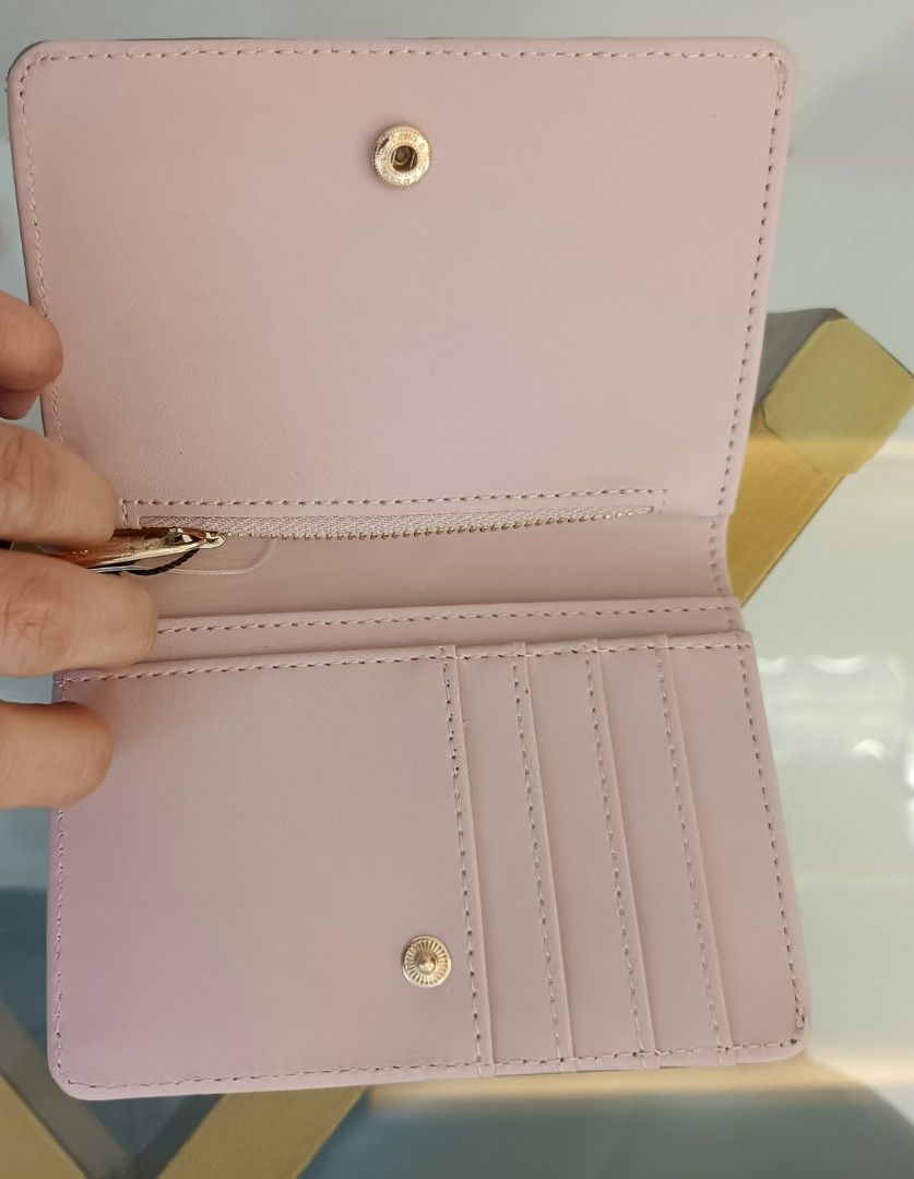 Nanette Lepore Cherry Hearts Wallet (Category: Wallets & Card holders) located in Dagupan City. Submitted by nmcmp4 (Listing ID 1424055119, Image 3). Description: - Nanette Lepore wallet - Pink exterior - Cherry print interior - Multiple card slots - Zippered compartment - Snap closure - Gold-tone logo - Style: "Ballet & Pink Cherry Hearts" - no box.