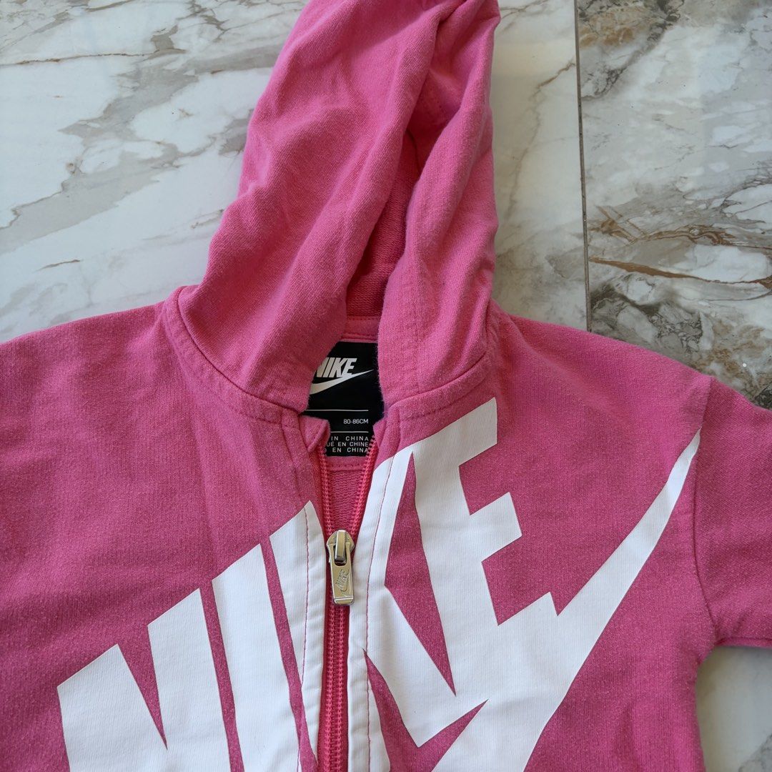 Nike Baby Jumpsuit 18M (Category: Babies & Kids Fashion) located in Bulacan. Submitted by speczone (Listing ID 1424140360, Image 3). Description: - Pink Nike baby jumpsuit - Size: 18 months (80-86cm) - Full zip closure and hood - White Nike logo on front and back - Two front pockets - Sign of usage.