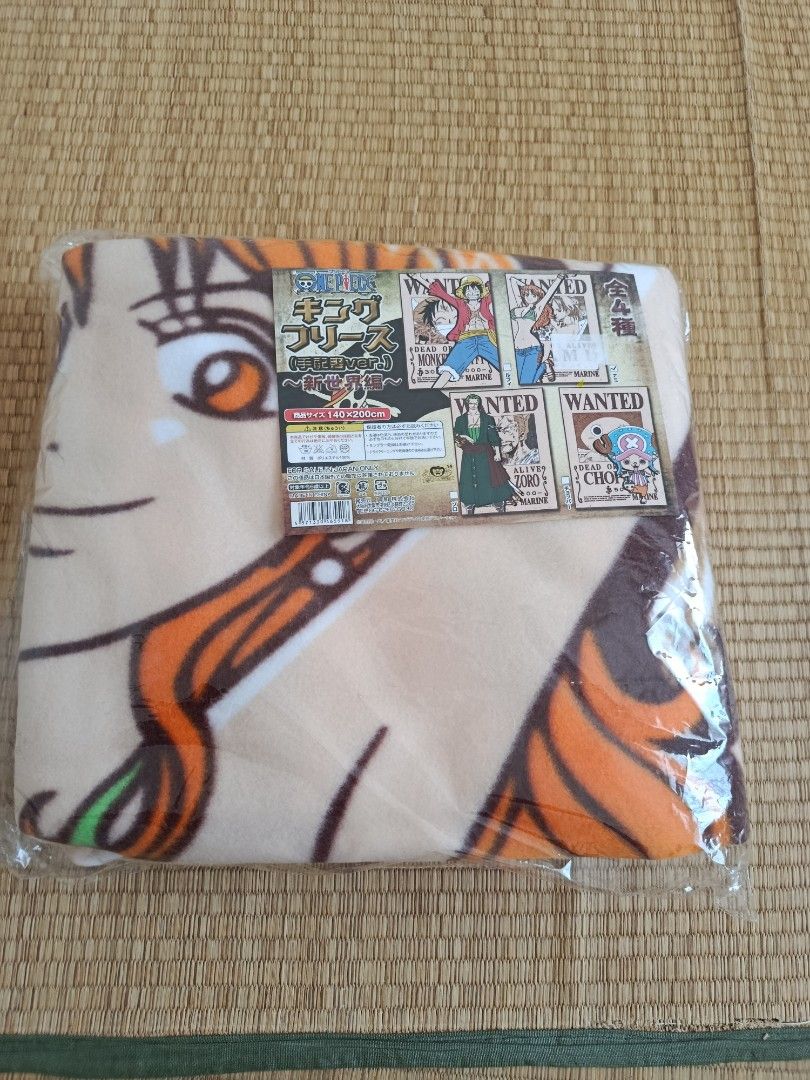 One Piece Nami Fleece Blanket (Category: Bedding & Towels) located in Bacoor. Submitted by etcee.ph (Listing ID 1424053740, Image 1). Description: - Brand new One Piece fleece blanket. - Features Nami's face and wanted posters. - King Fleece size. - Still in original packaging..