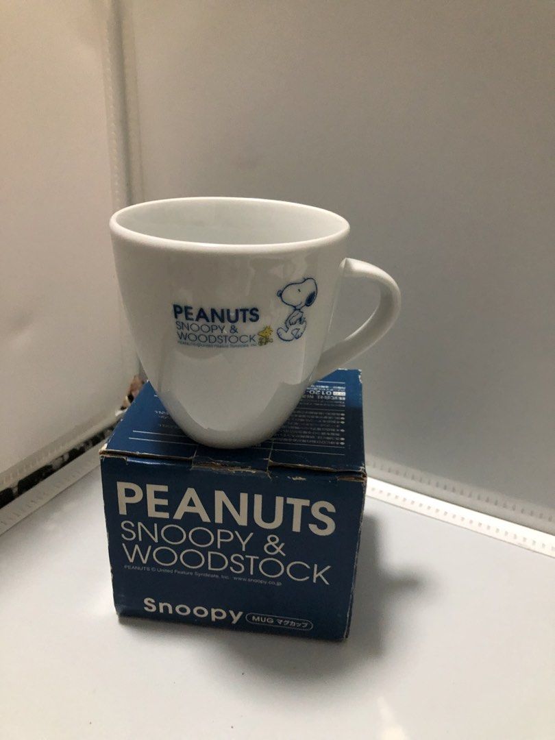 Peanuts Snoopy & Woodstock Mug (Category: Coffee & Tea Tableware) located in Manila. Submitted by rey_stat.store (Listing ID 1424133499, Image 2). Description: - Snoopy and Woodstock mug - Features the Peanuts logo and character illustrations in blue - White mug body - Includes original box - Ideal for Peanuts enthusiasts.