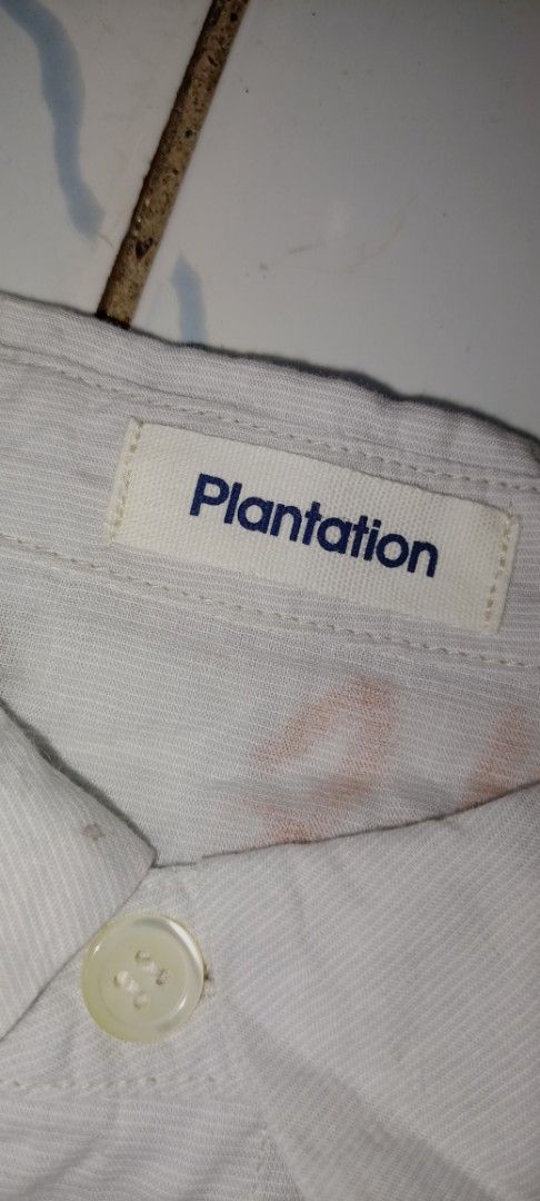 Plantation Long Sleeve Shirt (Category: Shirts) located in Mandaue City. Submitted by chaseandchast (Listing ID 1424156693, Image 2). Description: - Plantation long sleeve shirt - Size: M - Made in Vietnam - Color: Light Grey - Material: 99% Cotton, 1% Polyurethane - Features: Button-down front, collared neckline - Measurements (approximate): 22" armpit to armpit, 26" shoulder to hem.
