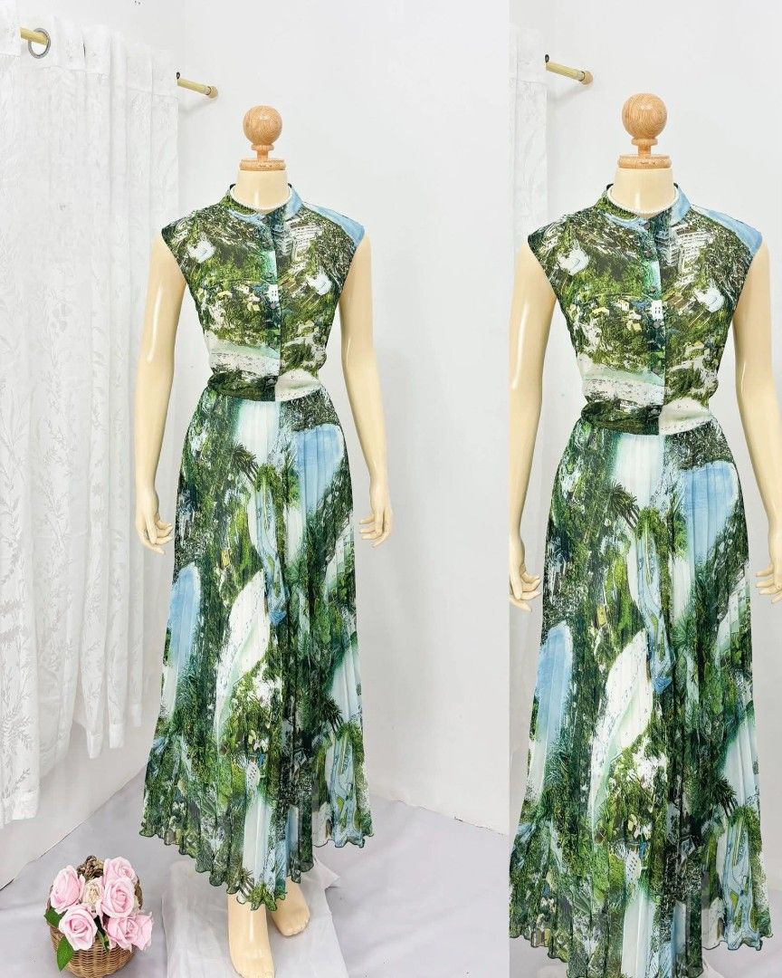 Printed Green/Blue Chiffon Maxi Dress (Category: Dresses) located in Taguig. Submitted by bentahe.studios (Listing ID 1424156924, Image 1). Description: - Fits S-M - Sleeveless maxi dress - Unique green and blue print - Mandarin collar - Pleated skirt - Defined waistline - Button-down front - Lightweight, flowing fabric - Perfect for warm weather.