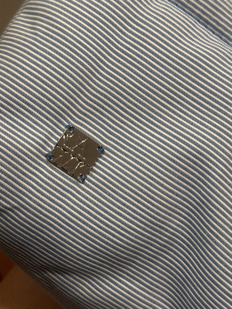 Rawit Puff Bag (Thailand Brand) (Category: Shoulder Bags) located in Manila. Submitted by fabkikay01 (Listing ID 1424052904, Image 2). Description: - Light blue and white striped pattern - Padded design - Rectangular shape - Long, padded strap - Small, square metal emblem - Made of soft, textured fabric.