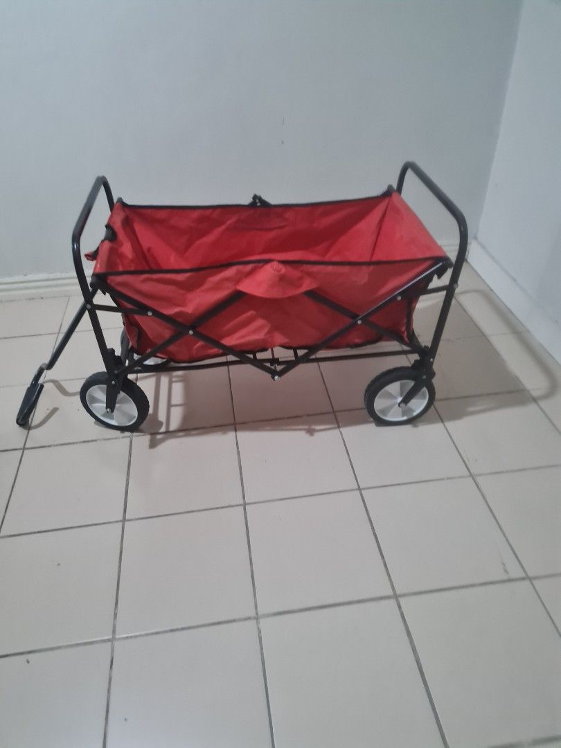 Red Folding Wagon (Category: Strollers) located in Quezon City. Submitted by declutter1990 (Listing ID 1424033241, Image 1). Description: - Red folding wagon - Black frame - Four wheels - Foldable for easy storage - Ideal for carrying items Collapsible Folding Outdoor Utility.