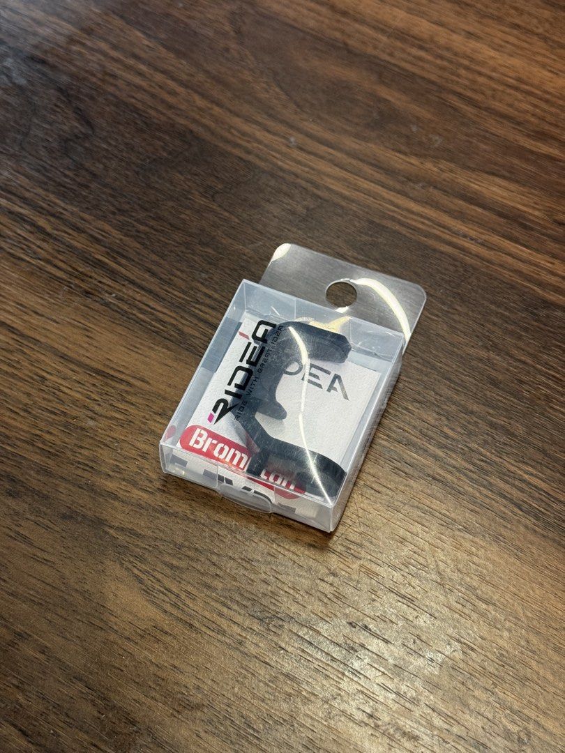 Ridea E‑Type Hook (Brompton) (Category: Parts & Accessories) located in Singapore. Submitted by luckie_store (Listing ID 1424037266, Image 2). Description: Ridea E‑Type Hook (Brompton) CNC‑machined E‑type hook from Ridea designed for Brompton folding bicycles without full mudguards. It lets you secure the front fork against the frame when the bike is folded — preventing rattling, unwanted unfolding, or frame contact. ￼ ✔ CNC alloy + ABS plastic c