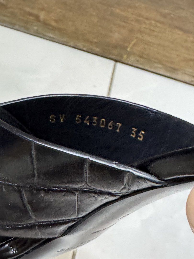 Saint Laurent Black Leather Sandals Size 35 (Category: Sneakers & Footwear) located in Pasig City. Submitted by ginaramos (Listing ID 1424038403, Image 3). Description: - Authentic Saint Laurent sandals - Black leather - Size 35 - Made in Italy - Criss-cross strap design - Block heel - Visible Saint Laurent logo - Minor wear on sole.