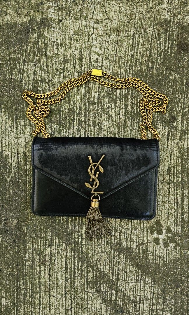 Saint Laurent Kate Tassel Chain Bag (Category: Luxury Bags & Wallets) located in Kibawe. Submitted by Thrift_ni_Babac (Listing ID 1424109827, Image 1). Description: FOR SALE: Saint Laurent (YSL) Kate Tassel Chain Bag ​Saint Laurent Kate Bag in black leather with rare python-textured YSL logo and gold-tone hardware. ​Condition: Pre-owned. Shows natural leather grain and minor wear on the interior/edges (see photos for details). ​Features: Iconic m