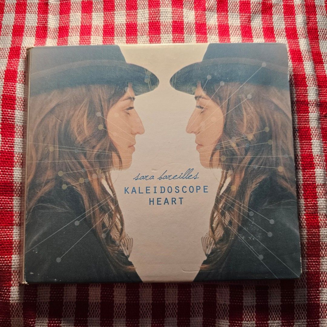 Sara Bareilles - Kaleidoscope Heart CD - CD VG Condition (Category: CDs & DVDs) located in Quezon City. Submitted by serefrenpaz (Listing ID 1424020627, Image 1). Description: - Sara Bareilles "Kaleidoscope Heart" CD for sale. - Includes the CD case and disc. - Features popular tracks: "Kaleidoscope Heart," "Uncharted," and "Gonna Get Over You." - CD case shows minor wear and tear..