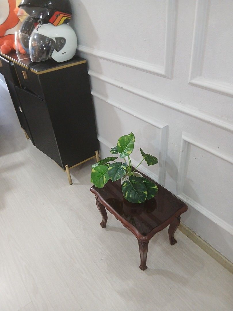 Side Table (Category: Tables & Sets) located in Singapore. Submitted by aliaini (Listing ID 1423991533, Image 1). Description: Selling small solid wood side table. Strong, sturdy and stable. length 49m. width 32m. ✨ Suitable as: Bedside table Living room side table TV stand for small TV Decorative corner table 📌 Condition: heavilt Used but well kept Minor signs of use Plant shown in photo is for decoration only (NOT included) Self-collect prefer