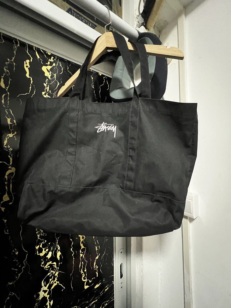 Stussy Black Tote Bag (Category: Tote Bags) located in Dasmarinas. Submitted by corruptdot (Listing ID 1424009944, Image 2). Description: - Black Stussy tote bag - Embroidered Stussy logo - Durable fabric - Two handles for carrying - Spacious design.