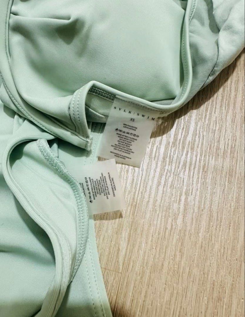 SYLK SWIM Bikini Set - XS (Category: Bikinis & Swimsuits) located in Mandaluyong City. Submitted by pechut.17 (Listing ID 1424061760, Image 3). Description: - Brand: SYLK SWIM - Color: Mint Green - Top: High-neck with mesh detail and back zipper - Bottom: High-waisted - Size: XS - Perfect for beach trips!.