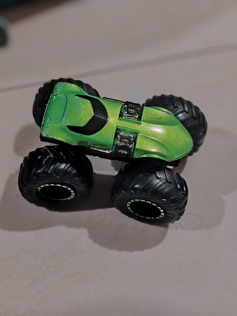 take all Hot Wheels Monster Truck (Category: Vehicle & Diecast Models) located in Pasig City. Submitted by geraldnee28280 (Listing ID 1424161833, Image 3). Description: - Hot Wheels Monster Truck Collection - Includes: - Green truck with orange accents - Blue truck with white accents - Green truck - Blue truck details: "Made in Indonesia" and "©1986 Mattel".