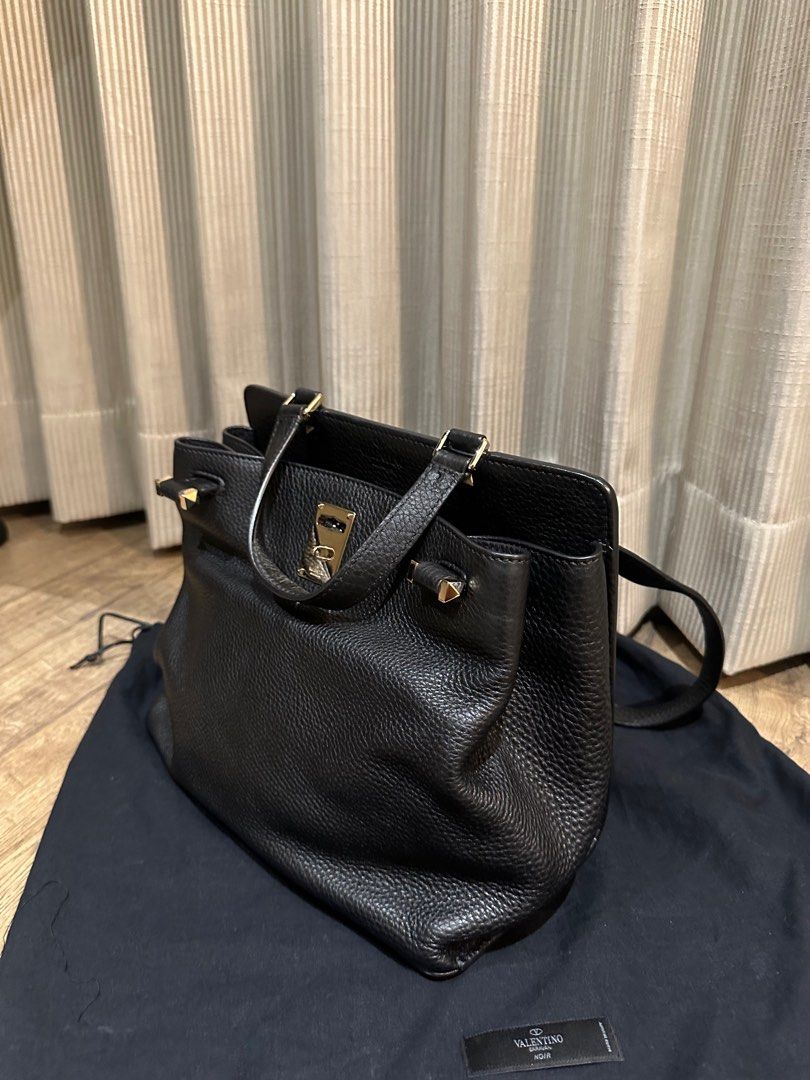 Valentino Garavani Joylock Tote (Category: Luxury Bags & Wallets) located in Manila. Submitted by harleyscloset (Listing ID 1424130825, Image 3). Description: Authentic Valentino Garavani Joylock tote in black grained leather with gold hardware. Spacious and structured, perfect for work or everyday luxury. Comes with dust bag. Very good condition with minimal signs of use..