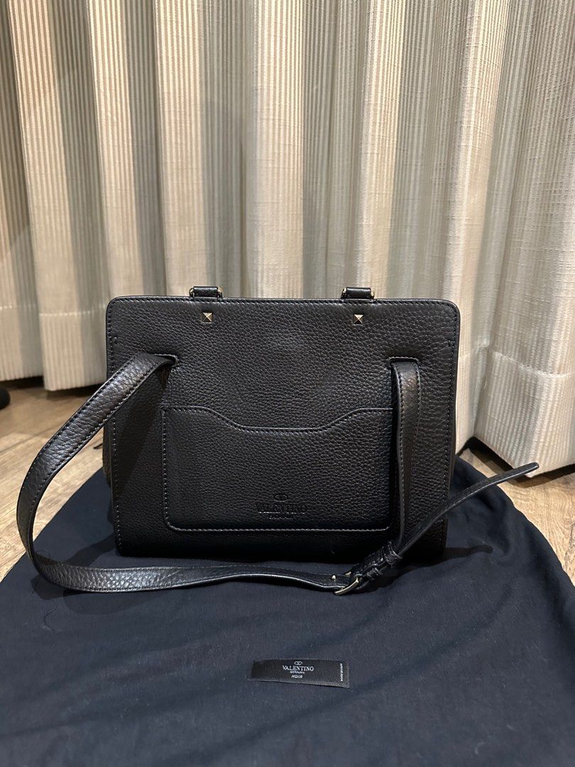 Valentino Garavani Joylock Tote (Category: Luxury Bags & Wallets) located in Manila. Submitted by harleyscloset (Listing ID 1424130825, Image 2). Description: Authentic Valentino Garavani Joylock tote in black grained leather with gold hardware. Spacious and structured, perfect for work or everyday luxury. Comes with dust bag. Very good condition with minimal signs of use..