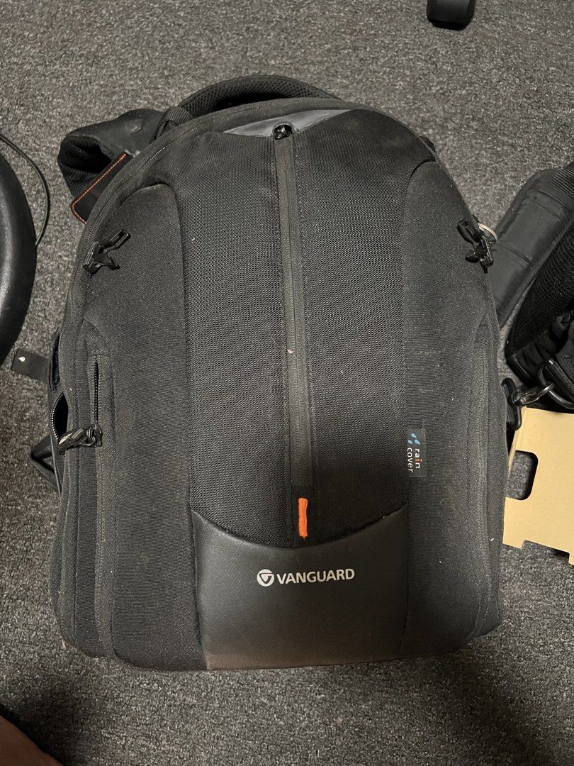 Vanguard Camera Backpack (Category: Camera Bags & Carriers) located in Caloocan City. Submitted by truedeer.aef77b (Listing ID 1423998928, Image 2). Description: - Vanguard camera backpack - Black exterior - Orange interior lining - Adjustable compartments - Multiple accessory pockets - Padded design for gear protection - Designed for camera equipment.