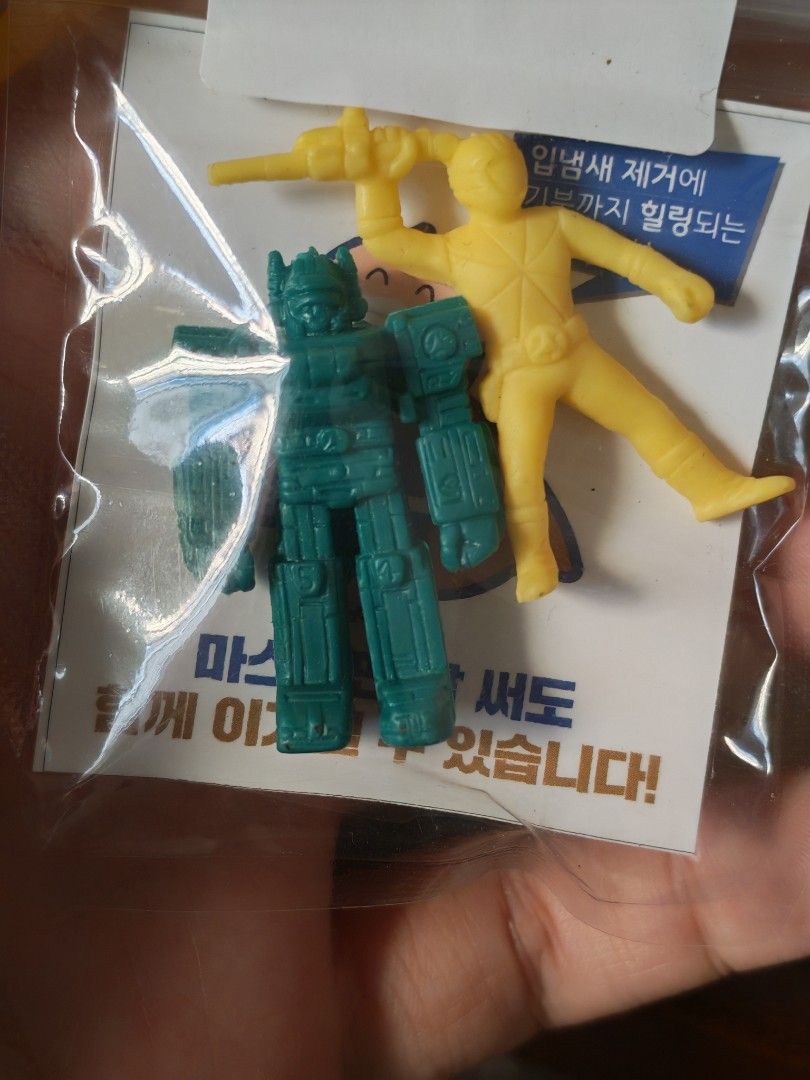 Vintage Toy Figures Set like Bioman (Category: Figurines & Statues) located in Manila. Submitted by GentleGiant (Listing ID 1423979440, Image 1). Description: - Vintage toy figures for sale! - Includes: - One green robot figure - One yellow superhero figure - Four stickers with Korean text - Likely from a collectible set. - Perfect for collectors!.