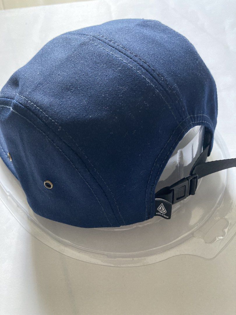 Volcom Snapback Cap (Category: Cap & Hats) located in Ampang. Submitted by hartanah_malaya (Listing ID 1424085686, Image 3). Description: - Navy blue Volcom snapback cap - Features the Volcom logo - Adjustable snapback closure - Classic five-panel design - Volcom branding on the interior.