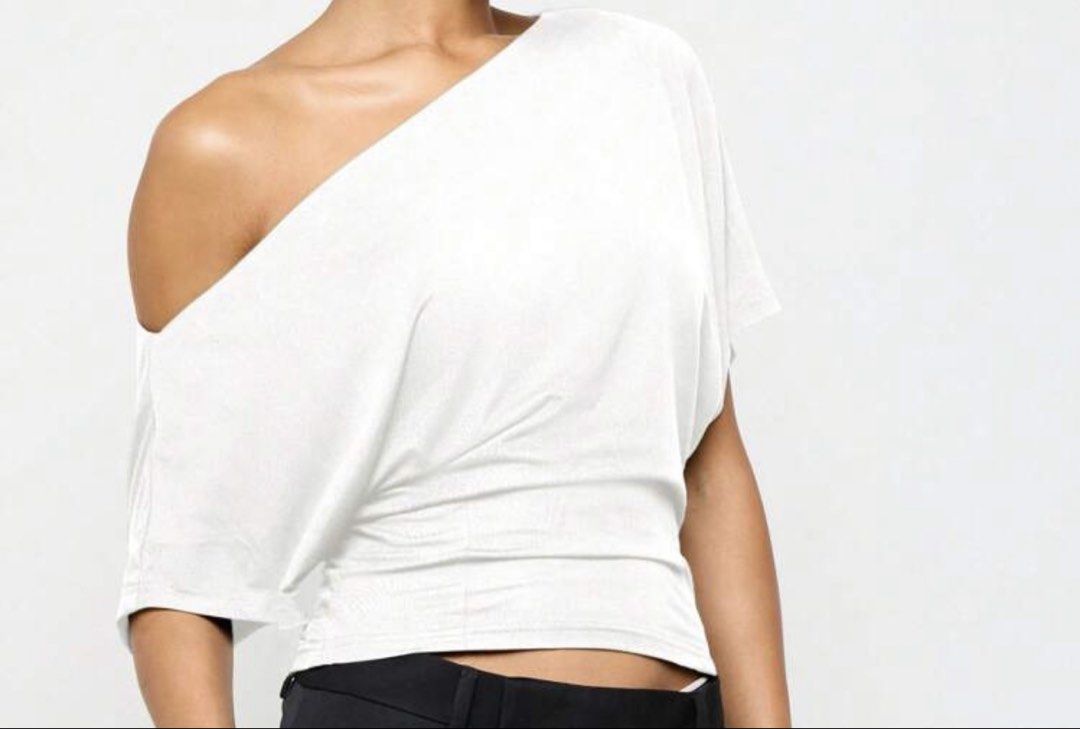 White One Shoulder Top (Category: Sleeveless) located in Makati City. Submitted by _fitz (Listing ID 1424137769, Image 1). Description: - Elegant white one-shoulder top - Draped design with short sleeves - Gathered waist detail for a flattering fit - Made from soft, flowing fabric - Perfect for a chic and stylish look - sf to be shouldered by buyer .