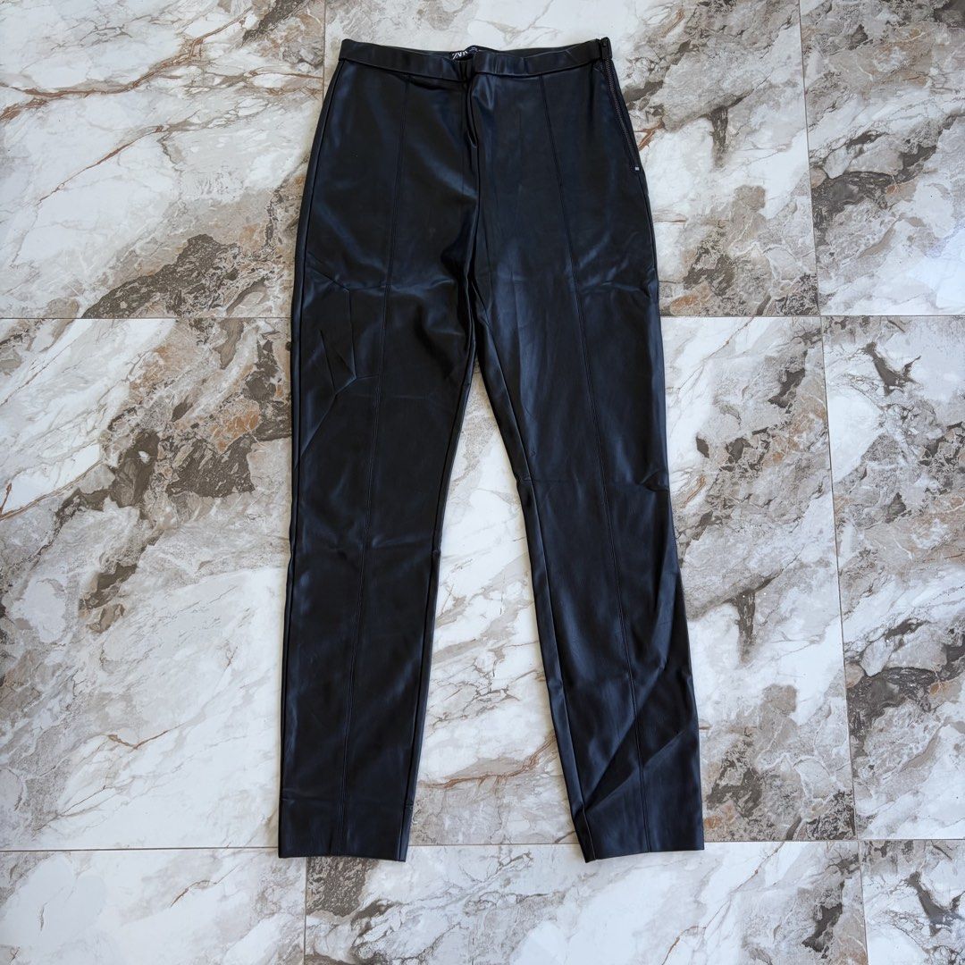 Zara Faux Leather Pants (Category: Jeans) located in Bulacan. Submitted by speczone (Listing ID 1424141439, Image 2). Description: - Zara black faux leather pants - Size: Medium - Features: High waist, slim fit, side zipper, seam detail - Material: Faux leather - Condition: Good.