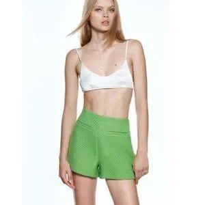 Zara Green Tweed Shorts (Category: Shorts) located in Mandaluyong City. Submitted by chasingbliss (Listing ID 1423998105, Image 2). Description: - Zara green shorts - Textured fabric - High-waisted design - Two front pockets - Perfect for casual or dressed-up looks - Versatile wardrobe piece.