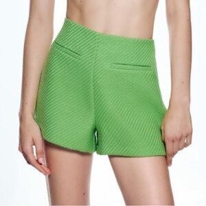 Zara Green Tweed Shorts (Category: Shorts) located in Mandaluyong City. Submitted by chasingbliss (Listing ID 1423998105, Image 1). Description: - Zara green shorts - Textured fabric - High-waisted design - Two front pockets - Perfect for casual or dressed-up looks - Versatile wardrobe piece.