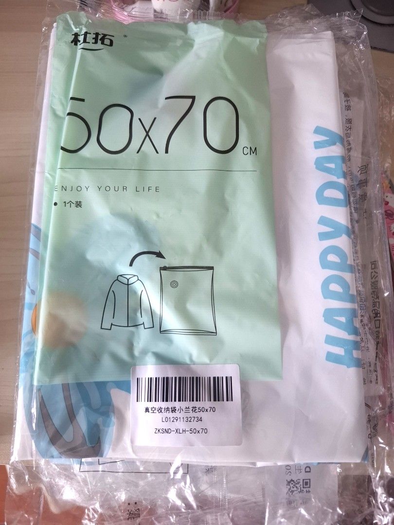 50x70cm Vacuum Storage Bag - sold each (Category: Storage Boxes & Baskets) located in Quezon City. Submitted by ana-chan (Listing ID 1425753178, Image 3). Description: These vacuum storage bags are 50x70cm in size. They are designed to compress clothing and other items for space-saving storage. The bags feature a floral design and include instructions for use. They are ideal for organizing and protecting items from dust and moisture. Each bag is 