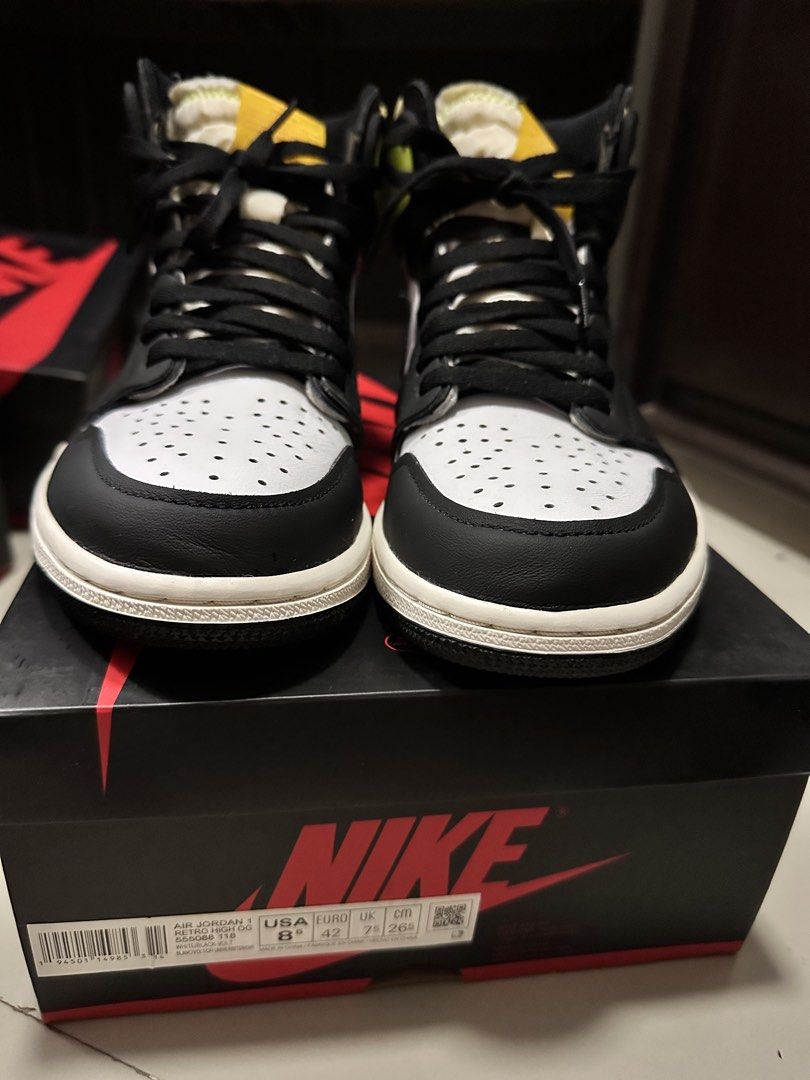 Air Jordan 1 Retro High OG Volt Gold (Category: Sneakers) located in Lipa City. Submitted by mochii13 (Listing ID 1425646489, Image 1). Description: Air Jordan 1 Retro High OG Volt Gold sneakers. Features a black, white, and volt yellow colorway. The shoes are high-top with a classic design. Includes the original box. The size is US 8.5. The shoes have black laces and a white midsole. Last pic for reference only FREE SHIPPING.