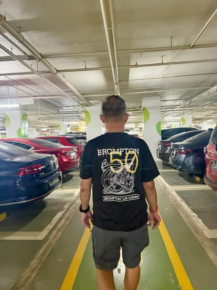 Brompton 50th Anniversary T-Shirt (Category: Parts & Accessories) located in Singapore. Submitted by stellatey23 (Listing ID 1425665658, Image 3). Description: Brompton 50th Anniversary T-shirt. Features a unique design on the back and a small logo on the front. Made of a comfortable, breathable material. Perfect for Brompton enthusiasts or anyone looking for a stylish, commemorative tee. Microfiber dri fit, quick dry fabric material. Size S till