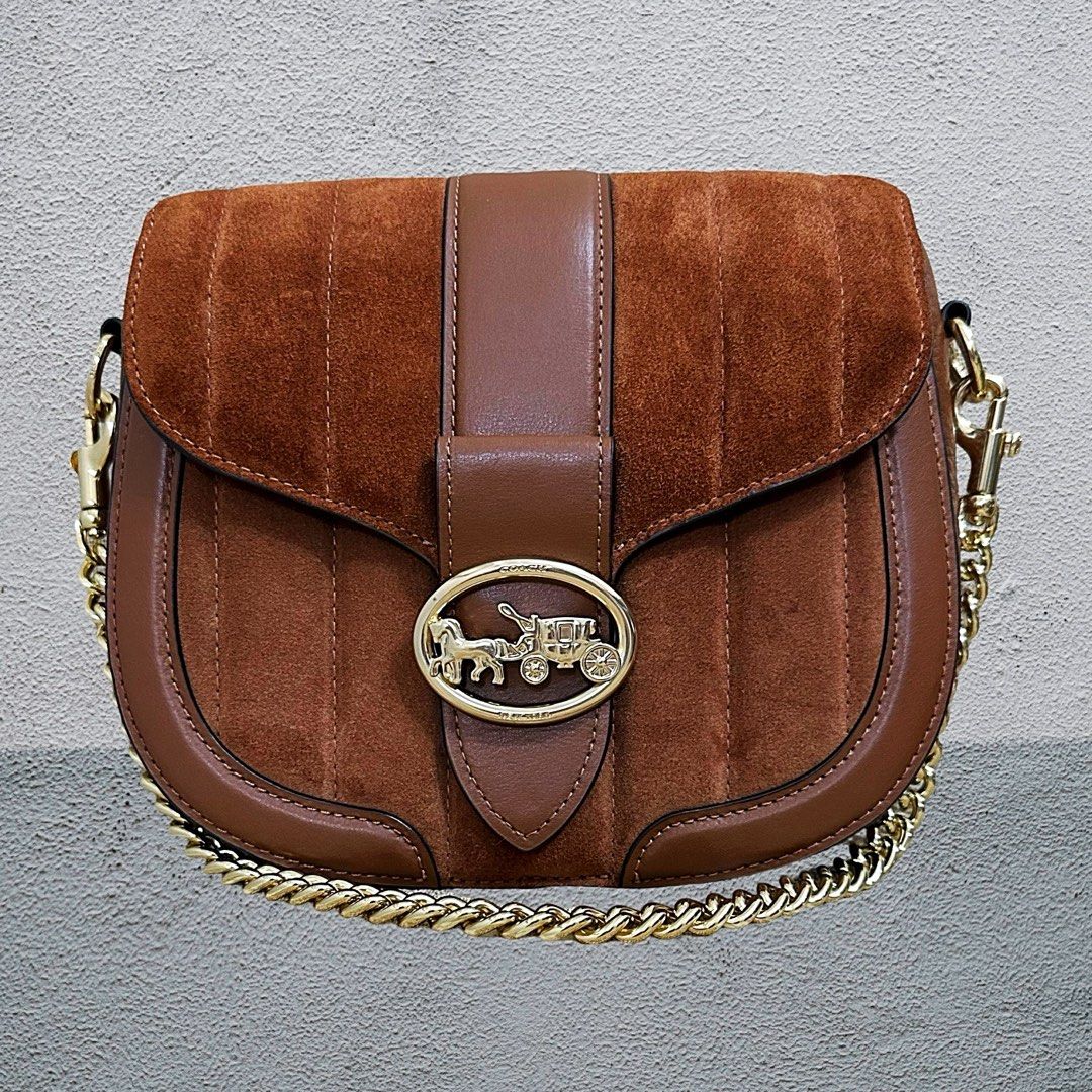 Coach Saddle Bag with Chain Strap (Category: Luxury Bags & Wallets) located in Las Pinas. Submitted by apple.mendoza.chan (Listing ID 1425650304, Image 1). Description: Coach saddle bag features a brown suede and leather design with a gold-tone chain strap. It has a flap closure with a gold-tone carriage logo..