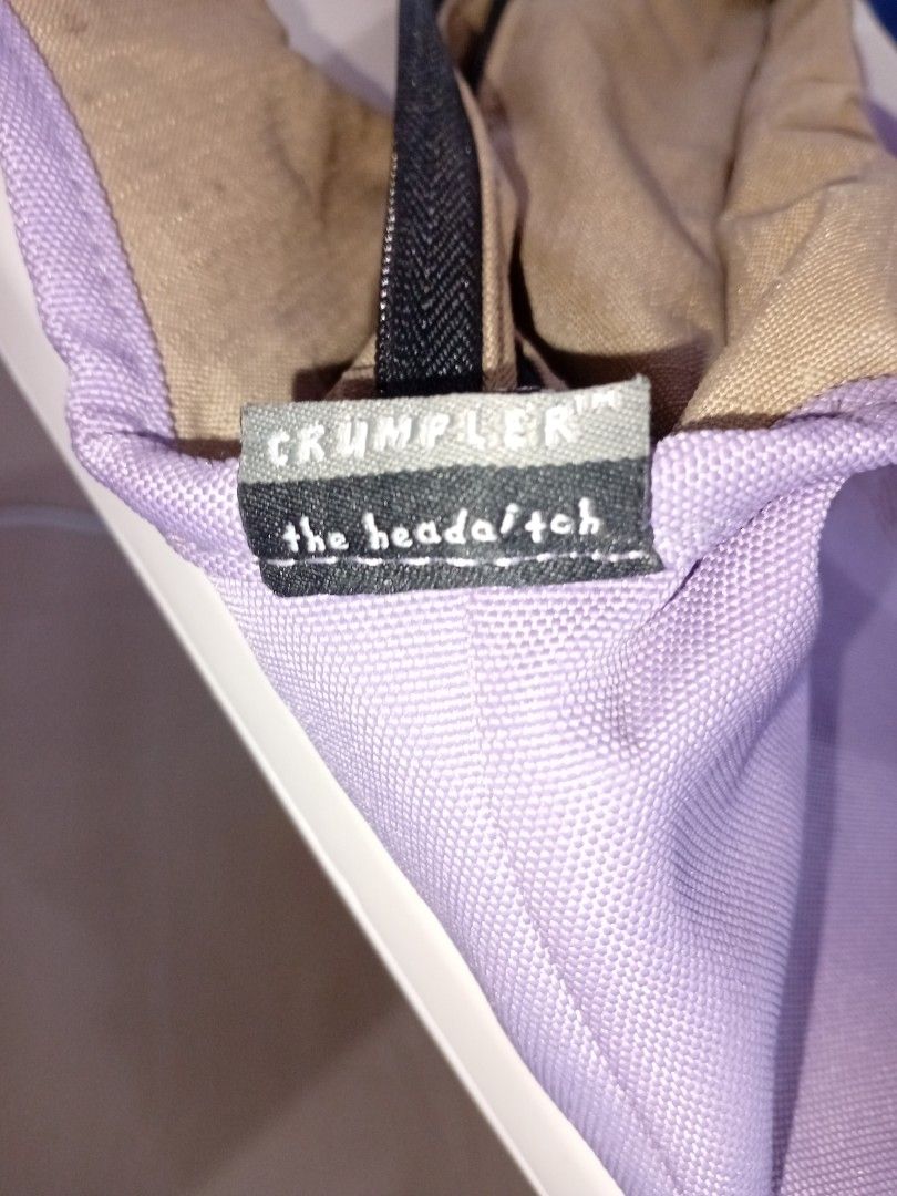 Crumpler the headatch Bag (Category: Luxury Bags & Wallets) located in Pasig City. Submitted by yaslei617 (Listing ID 1425819880, Image 1). Description: Bag features a purple exterior with a brown interior. It has a zipper closure and a Crumpler tag. The design is simple and functional, suitable for everyday use..