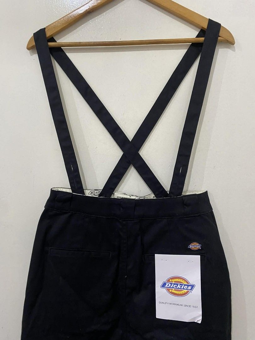 Dickies tight skirt with removable suspender (Category: Skirts) located in Pasig City. Submitted by psg2019 (Listing ID 1425678972, Image 2). Description: Dickies suspender skirt in black. Features a front slit and pockets. Includes original tags. The interior lining has a Dickies logo pattern. Size L. 28 waist 37 length brand new.