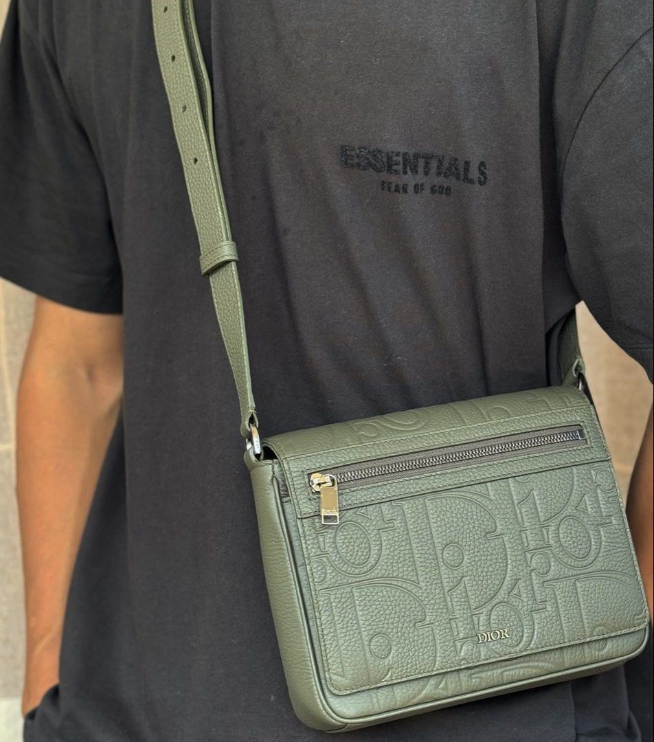 Dior (Category: Luxury Bags & Wallets) located in Pasig City. Submitted by donmsamson (Listing ID 1425763624, Image 2). Description: This bag is the Dior Hit the Road Messenger Bag with Flap in Khaki Dior Gravity Leather and grained calfskin. Key Features Material: It features a sophisticated combination of khaki Dior Gravity leather (a signature embossed leather) and grained calfskin. Design: The modern design includes a large magnetic flap with